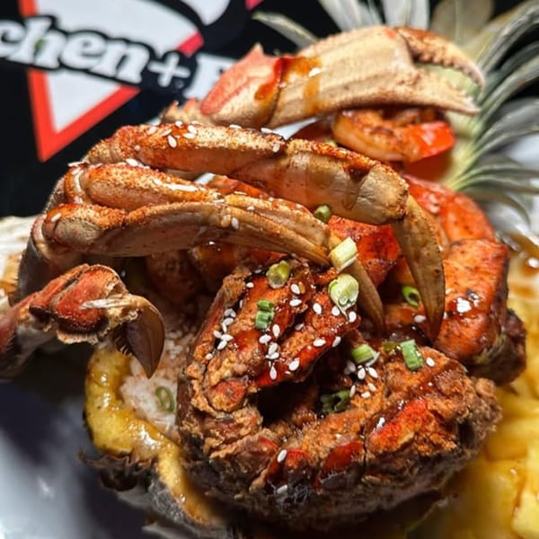 Cali Kitchen and Bar's fried crab and shrimp dish, garnished with sesame seeds and green onions.