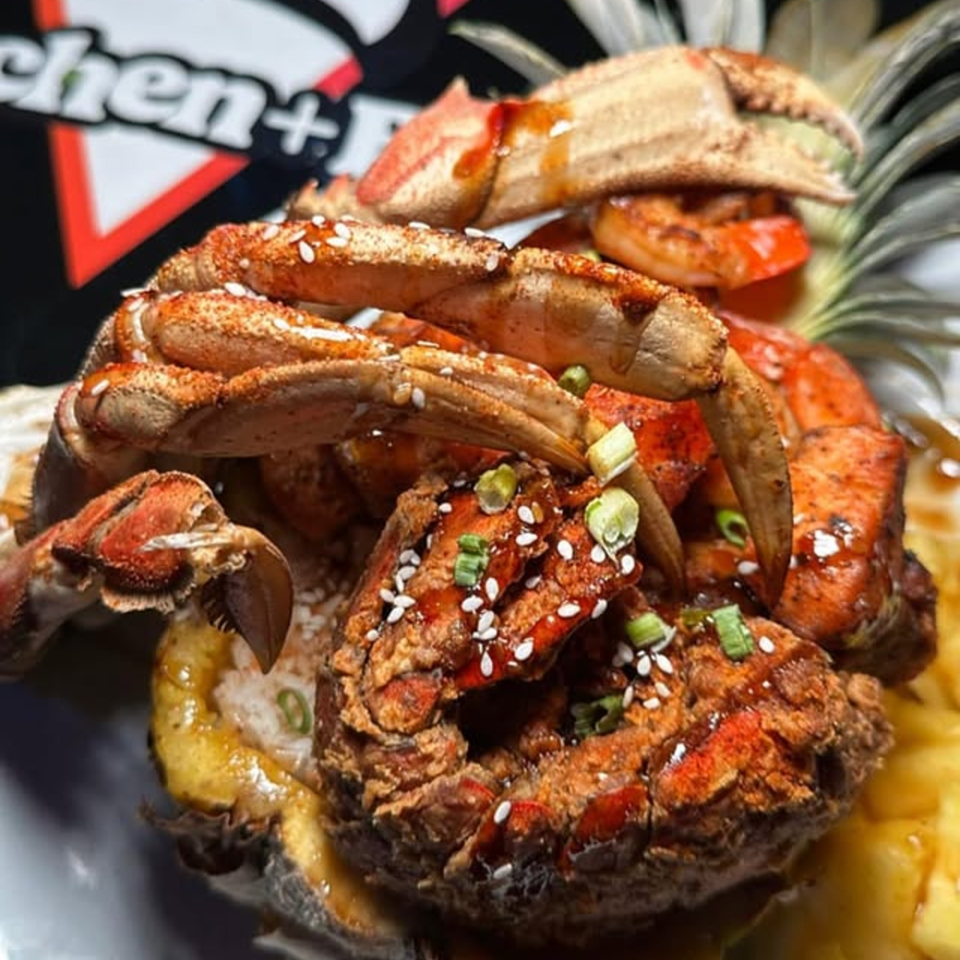 Cali Kitchen and Bar's fried crab and shrimp dish, garnished with sesame seeds and green onions.