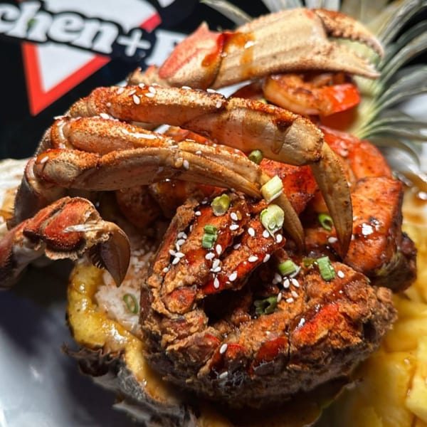 Cali Kitchen and Bar's fried crab and shrimp dish, garnished with sesame seeds and green onions.